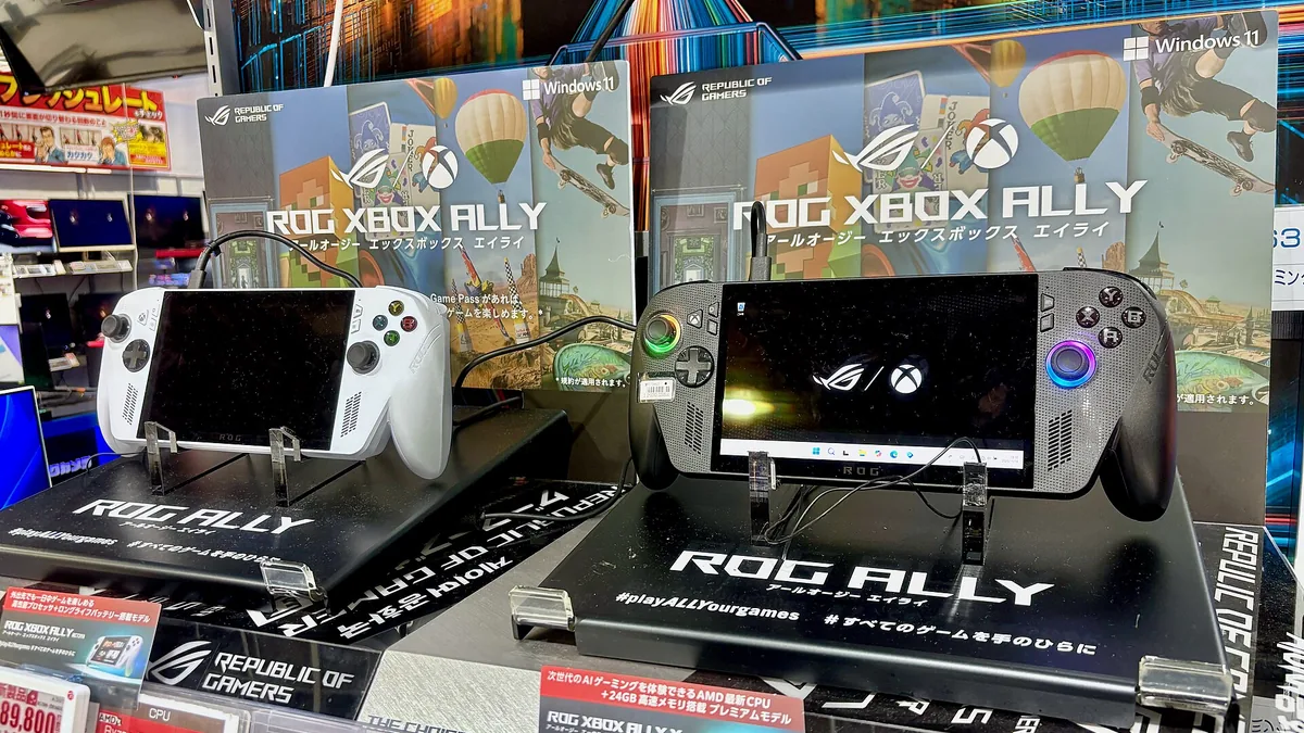 ROG Xbox Ally handhelds on display stands with prominent Xbox and Windows 11 branding.