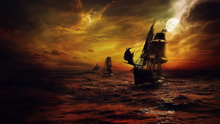 Silhouetted pirate ships sailing on a dramatic red-hued ocean under a golden cloudy sunset with a bright full moon.