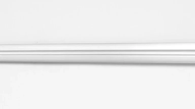 A close-up horizontal view of a silver metallic blade with a central groove against a plain light background.