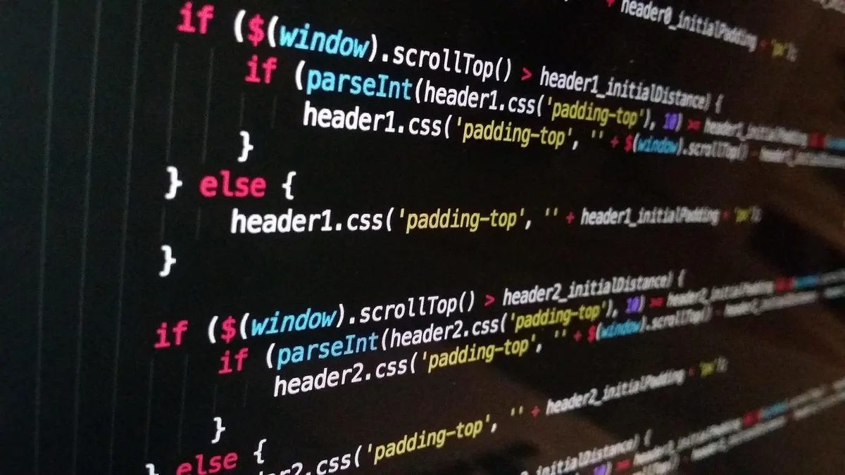 Close-up of colorful JavaScript code on a dark computer screen, showing scroll logic.