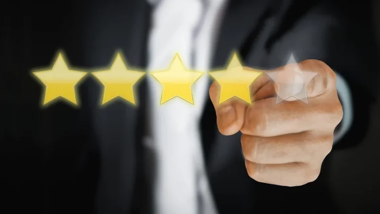 A hand pointing to a four-out-of-five gold star rating on a virtual screen.