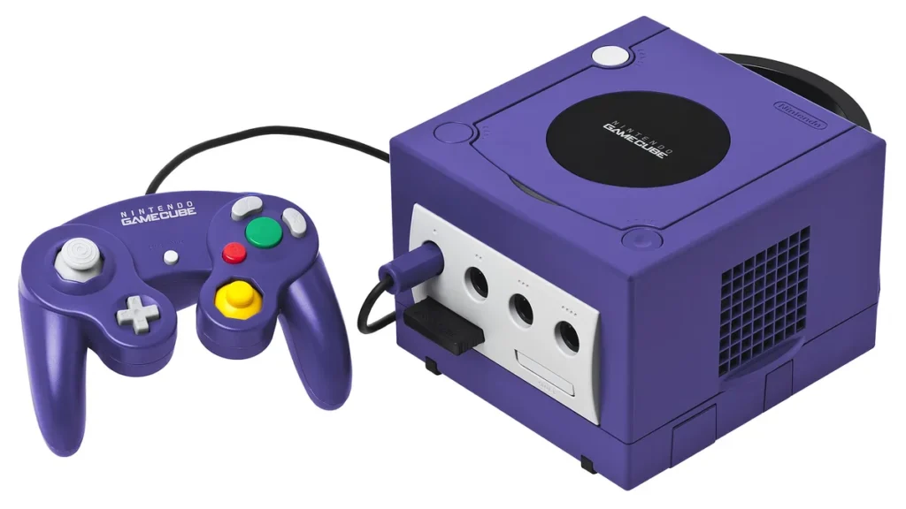A purple Nintendo GameCube console with its matching controller, showing the front ports and signature colorful buttons.