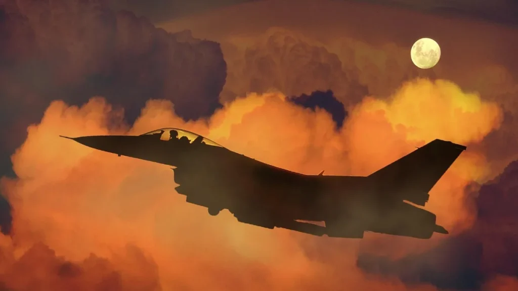 Silhouette of a fighter jet flying through orange clouds under a full moon.