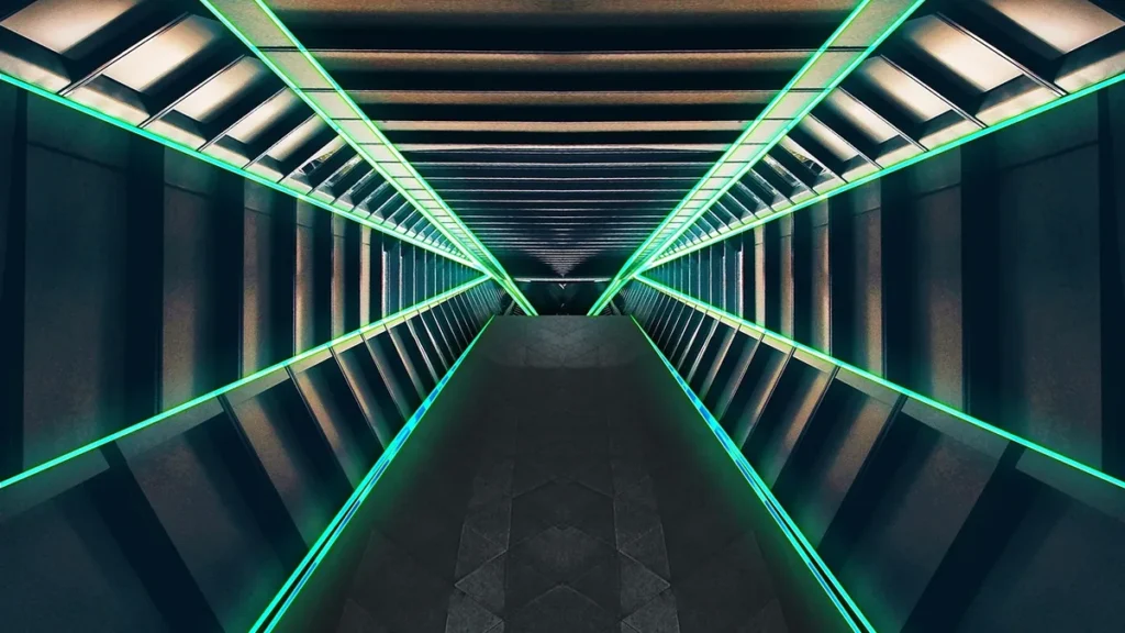 Symmetrical futuristic corridor glowing with bright green neon lines along metallic walls, evoking a sci-fi spaceship