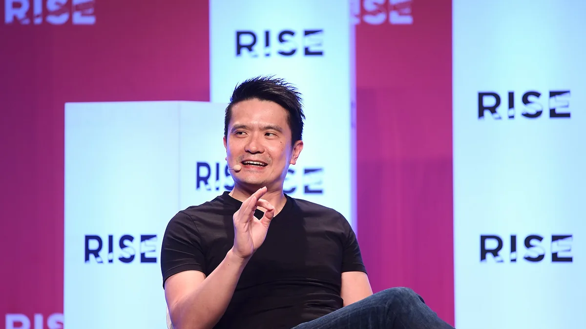 Liang, creator of Phantom Blade Zero, speaking at a RISE conference event.