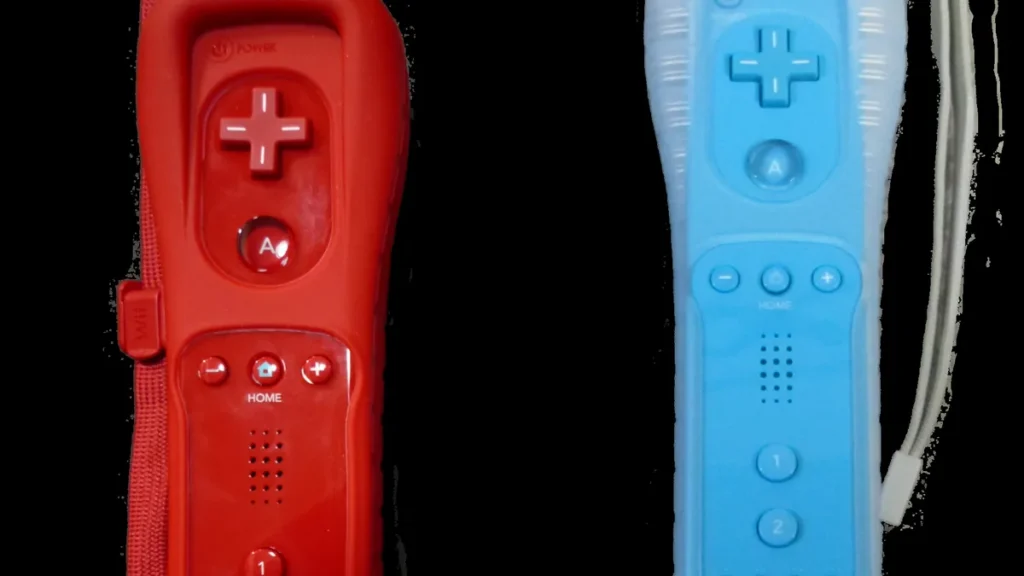 Red and blue Wii Remote controllers in silicone sleeves with wrist straps on a black background.