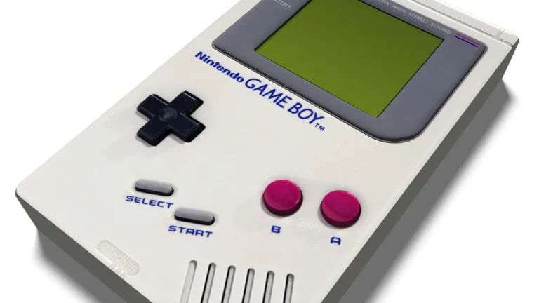 Classic white Nintendo Game Boy handheld console with a green screen, black D-pad, and red buttons.