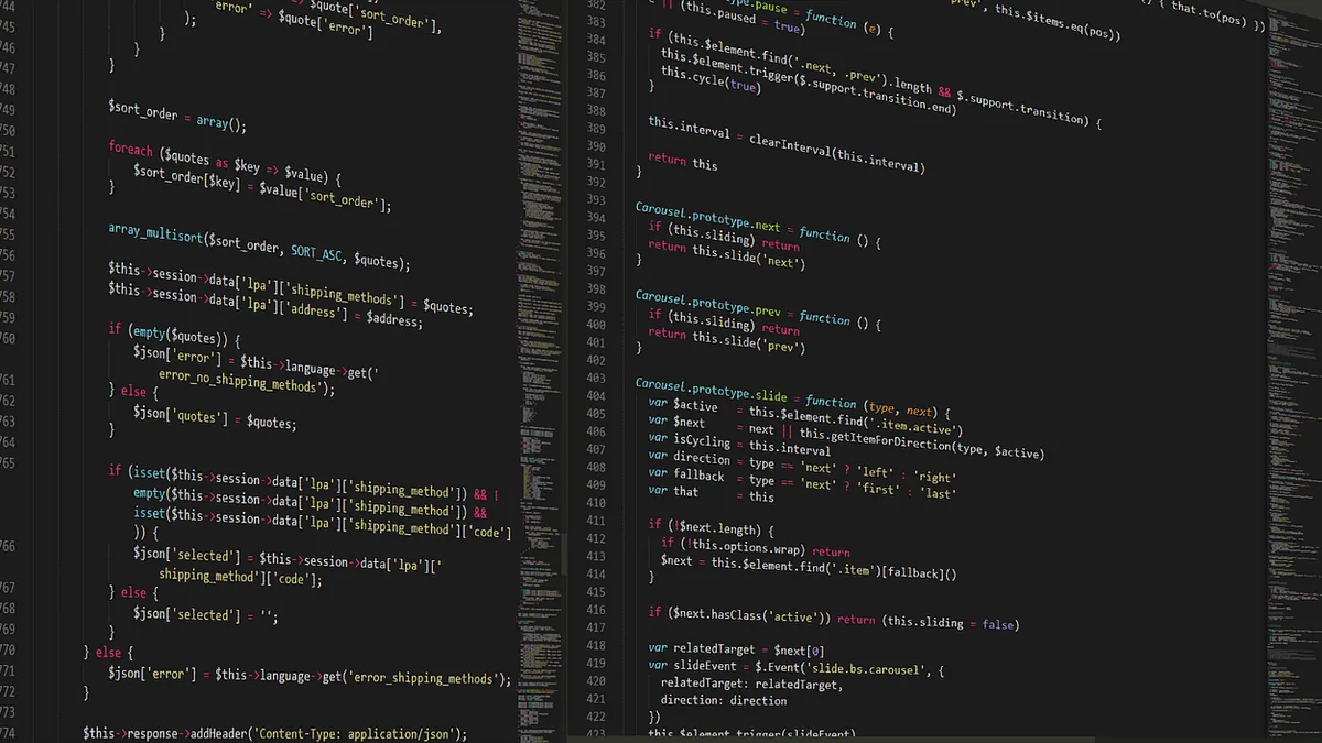 Dark screen displaying columns of colorful syntax-highlighted programming code with line numbers on the margins.