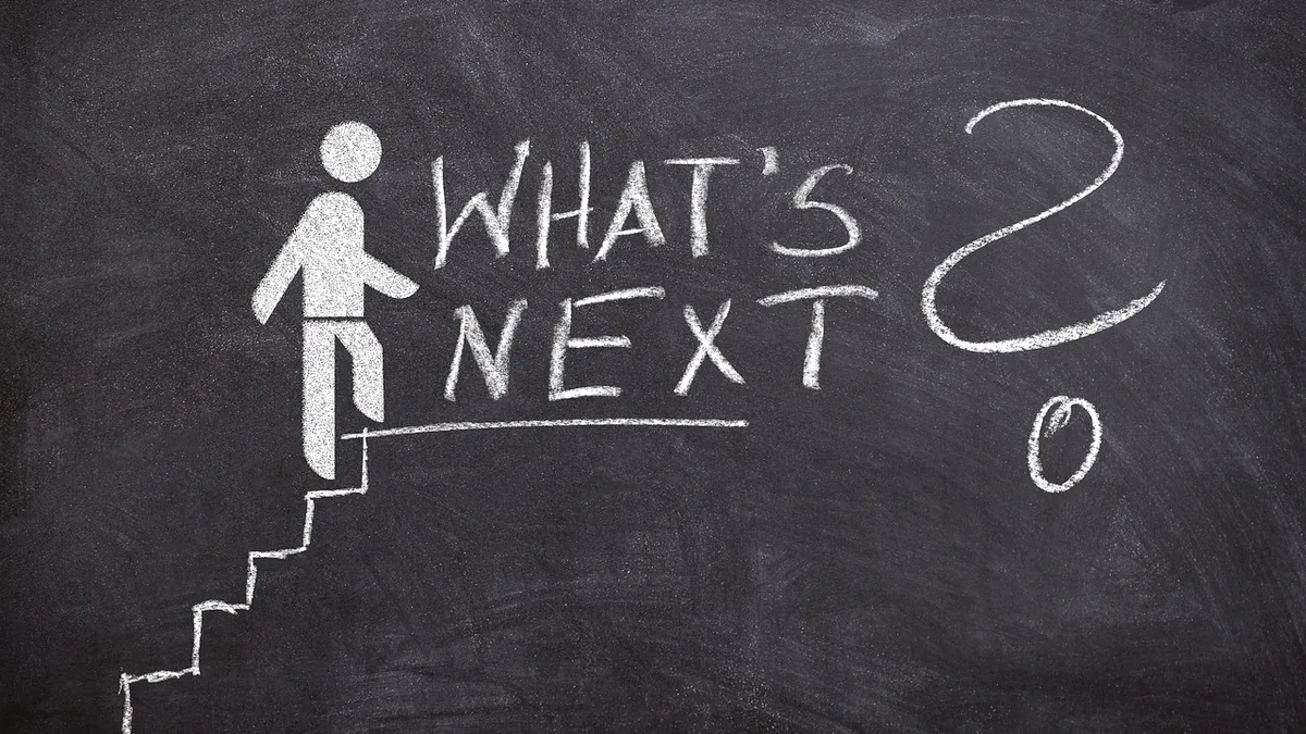 Chalkboard illustration of a stick figure climbing stairs with the handwritten text 'WHAT'S NEXT?' and a large question mark.